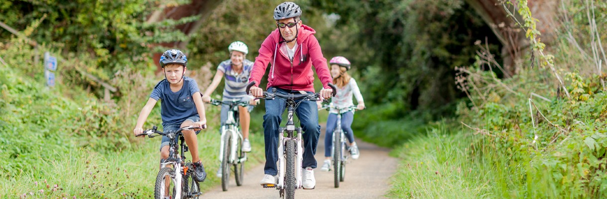 Family cycling in the countryside